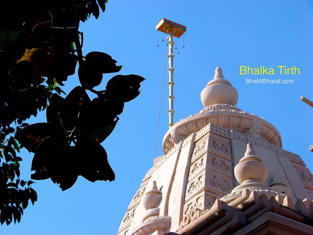 Center top shikar with flag among the greenery of Peepal and Banyan tree. Center top shikar with flag among the greenery of Peepal and Banyan tree.
