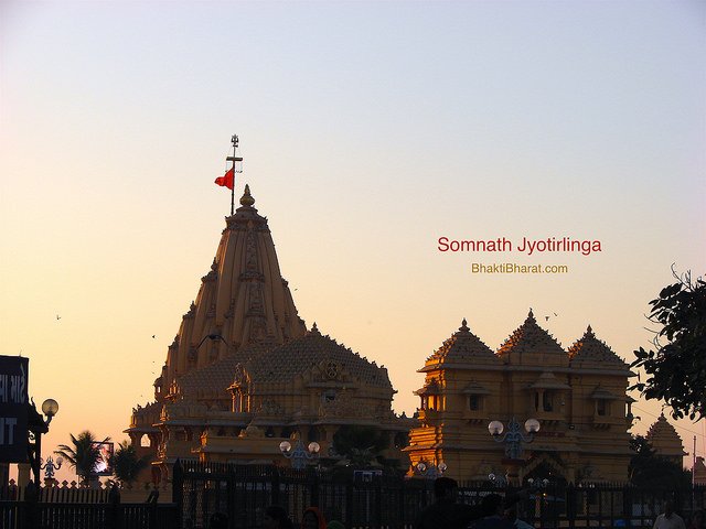 Highest main shikhar having red dhwaja, damru and trishul in front of the temple Highest main shikhar having red dhwaja, damru and trishul in front of the temple